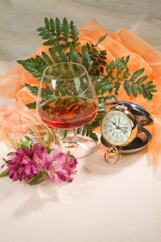 Still life with bouquet of flowers and accessories on a studio background