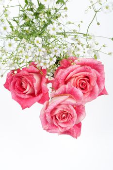 Still life with bouquet of flowers and accessories on a studio background