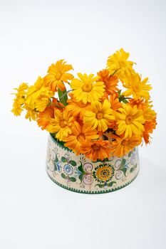 Still life with bouquet of flowers and accessories on a studio background