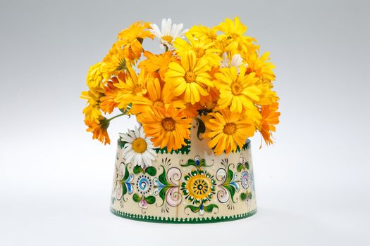 Still life with bouquet of flowers and accessories on a studio background