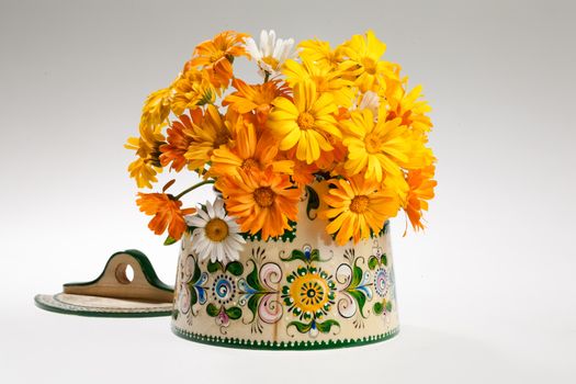 Still life with bouquet of flowers and accessories on a studio background