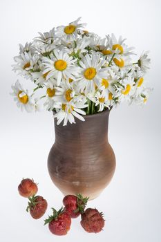 Still life with bouquet of flowers and accessories on a studio background