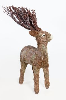 Handmade statuette of reindeer on isolated background