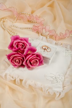 Still life with bouquet of flowers and accessories on a studio background