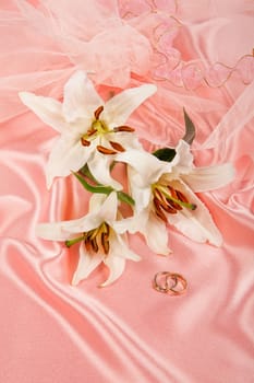 Still life with bouquet of flowers and accessories on a studio background