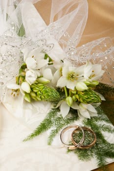 Still life with bouquet of flowers and accessories on a studio background