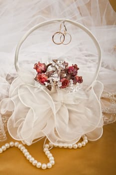 Still life with bouquet of flowers and accessories on a studio background