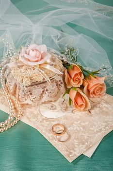 Still life with bouquet of flowers and accessories on a studio background