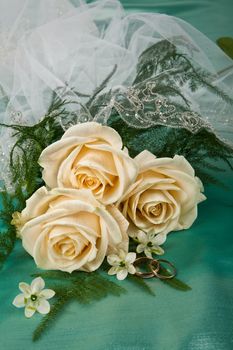 Still life with bouquet of flowers and accessories on a studio background