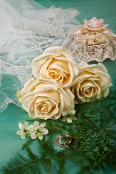 Still life with bouquet of flowers and accessories on a studio background