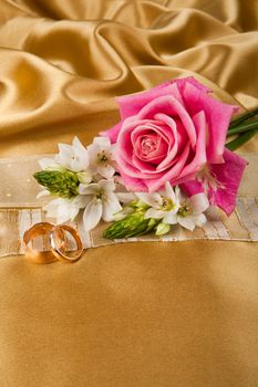 Still life with bouquet of flowers and accessories on a studio background