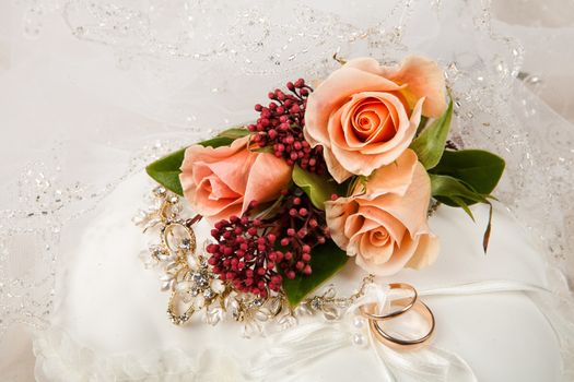 Still life with bouquet of flowers and accessories on a studio background
