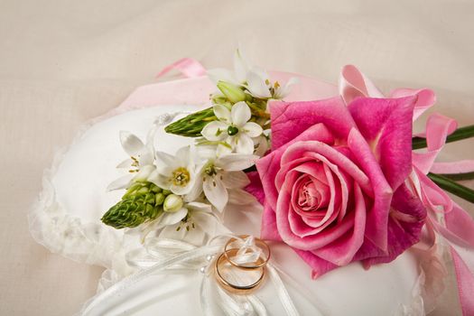 Still life with bouquet of flowers and accessories on a studio background