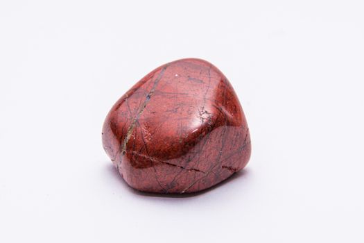 Breckzien jasper gem shining in powerful tones of deep red