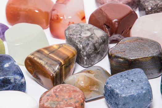 Collection of many kinds of polished gemstones originating from all continents