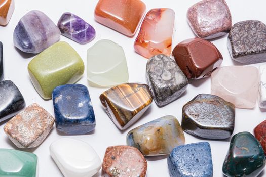 Collection of many kinds of polished gemstones originating from all continents