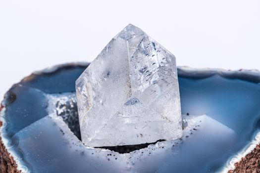 Dob rough diamond formed by volcanic heat and pressure inside earth on blue geode