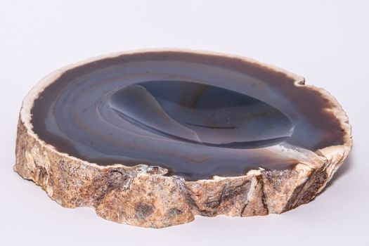 Slice of Geode blue colorful gemstone looking like normal rock from outside not hollow inside