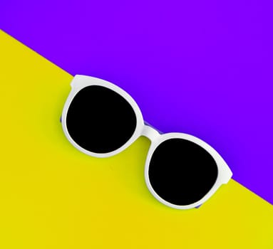 Sunny stylish white sunglasses on a bright purple-lilac and yellow-orange background, top view, isolated. Copy space. Flat lay.