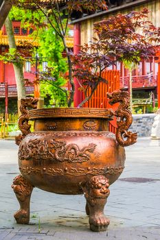 Beautiful japanese cauldron planter decorated with traditional dragons, Asian garden decorations