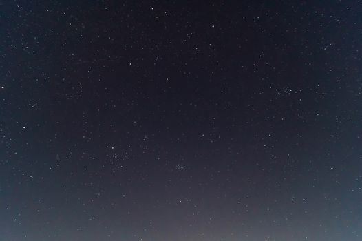  Underexposed night sky low light photo. A lot of stars and constellations on dark sky. Stock photo of deep sky.