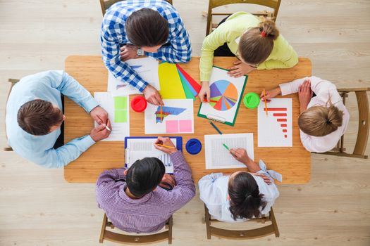 Group of multiethnic busy people working in an office, top view