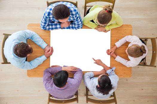 Hipster business teamwork brainstorming planning meeting concept, people team sitting around the table with white paper and pointing, copy space for content
