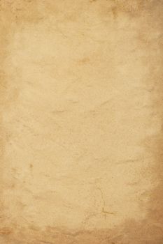 Old vintage grunge brown paper parchment background texture with dark stains