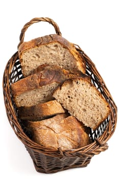 Close up of hearty artisan sourdough bread slices in a bread basket.