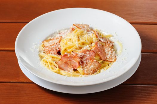 top view tagliatelli carbanara italian cuisine on plate rustic kitchen table background