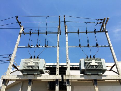 Electricity post and a blue sky background. electrical transformer