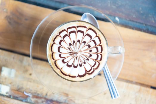 Hot coffee in white cup on the  table.