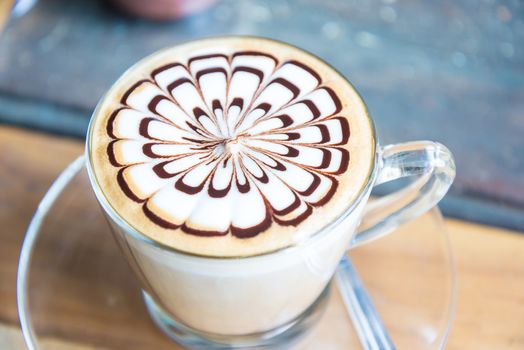 Hot coffee in white cup on the  table.