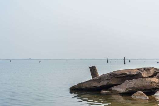 Rocks and stumps on the banks of the reservoir.