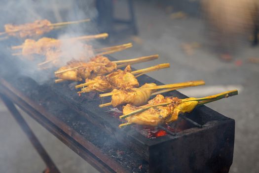 Malaysian traditional dishes, popular grilled spiced chicken Ayam Percik selling in Bazaar during the holy month of Ramadan.