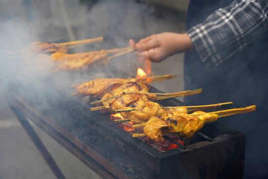 Malaysian traditional dishes, popular grilled spiced chicken Ayam Percik selling in Bazaar during the holy month of Ramadan.