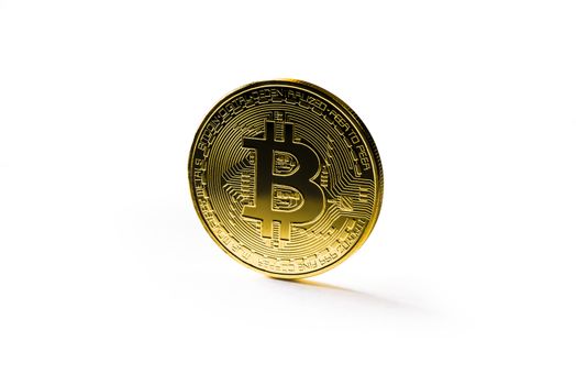 Golden Bitcoin coin on white background. Cryptocurrency