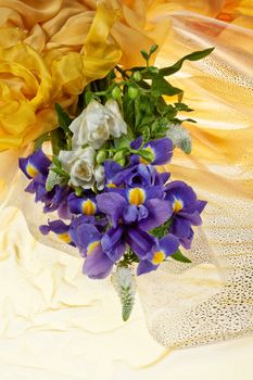 Bouquet of flowers on a fabric background