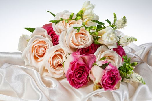 Bouquet of flowers on a fabric background