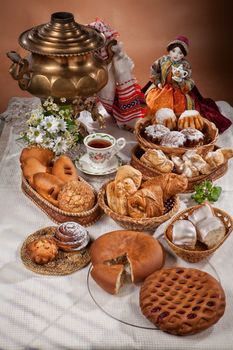 Still life with different kinds of bread on a tablecloth