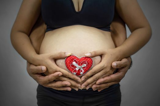 Close up  of pregnant  asian woman in black underwear