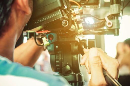 Behind the scene. cameraman shooting film scene with camera