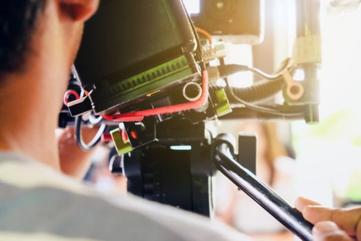 Behind the scene. cameraman shooting film scene with camera