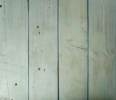 Colored wooden planks with cracks and scratches, background or texture