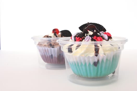two fancy cupcake on white background.