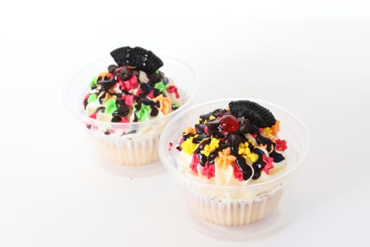 two fancy cupcake on white background