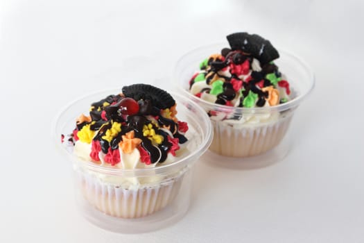 two fancy cupcake on white background