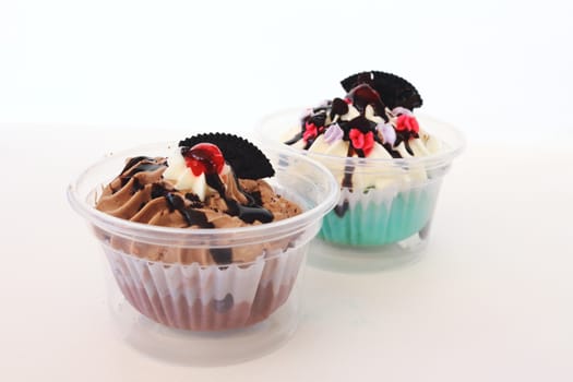 two fancy cupcake on white background
