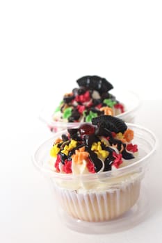 two fancy cupcake on white background