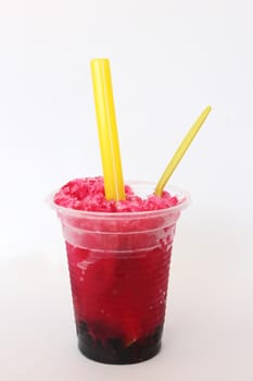 Glass of red shave ice on white background